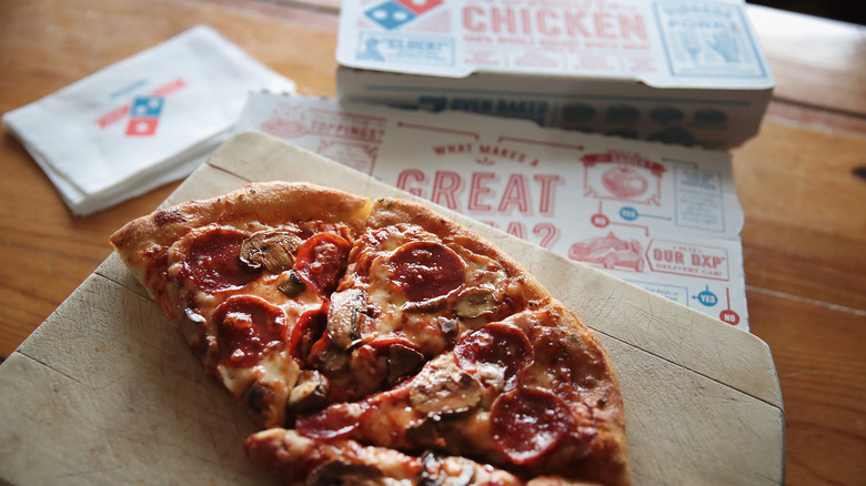 The Strange Reason Domino's Just Unveiled New Retro Pizza Boxes