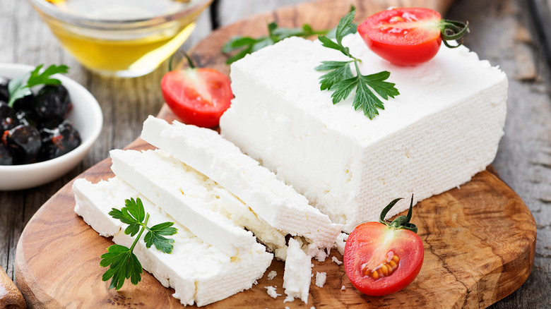 Feta cheese on wooden board