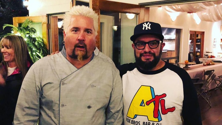 carl ruiz hugging guy fieri