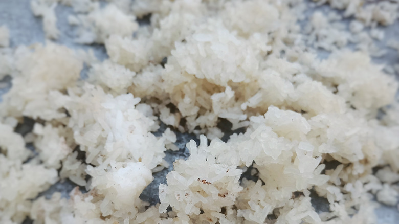 White rice clumps in pan