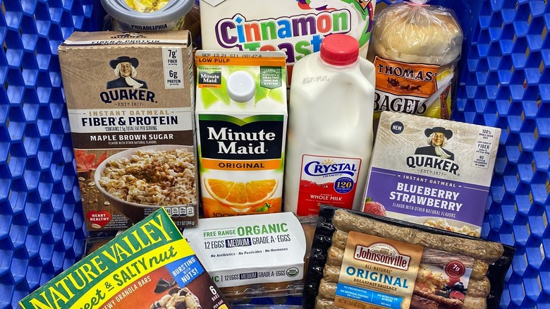 packaged food products inside blue grocery cart