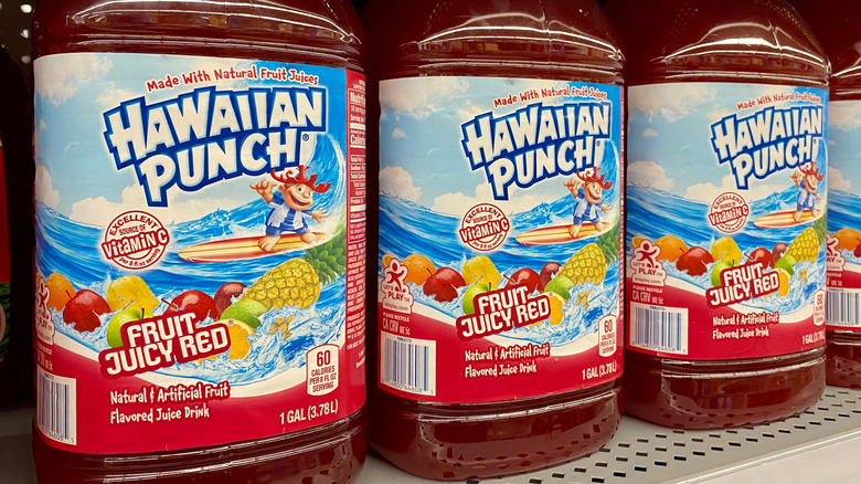 Four bottles of Hawaiian Punch on a shelf