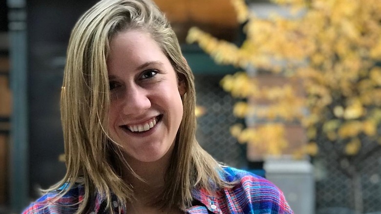 Closeup of Lidey Heuck smiling with tree in background