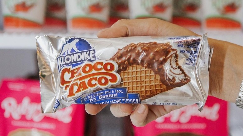 hand holding a klondike choco taco