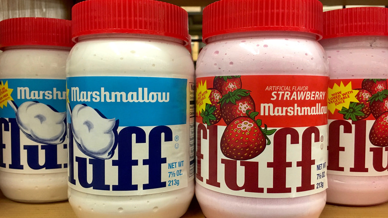 jars of Marshmallow Fluff on wooden shelf