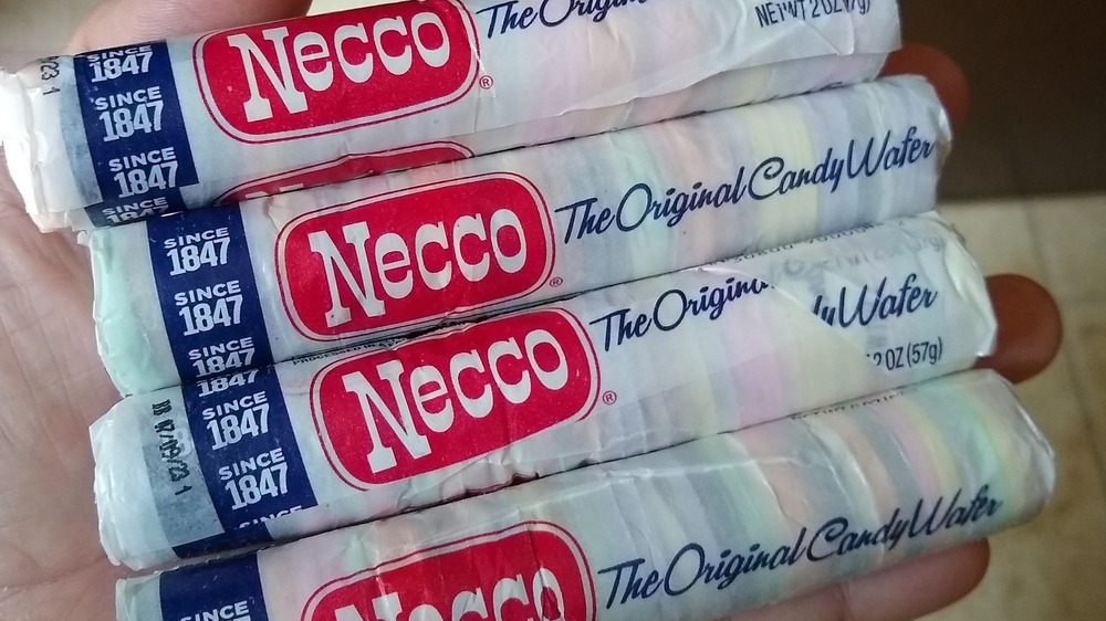 Hand holding Necco Wafers