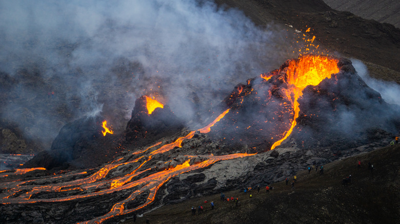 volcano erupting with smoke and lava