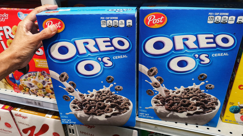 grabbing oreo o's from grocery store shelf