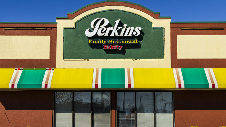 Perkins restaurant adobe with yellow, green, and red awning