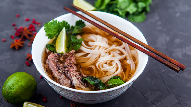 bowl of pho with chopsticks