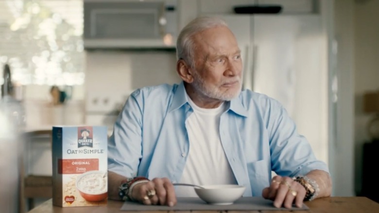 Buzz Aldrin at a table with bowl of oatmeal and Quaker Oats
