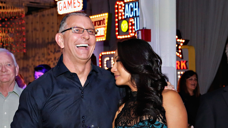 Gail and Robert laughing at an event.