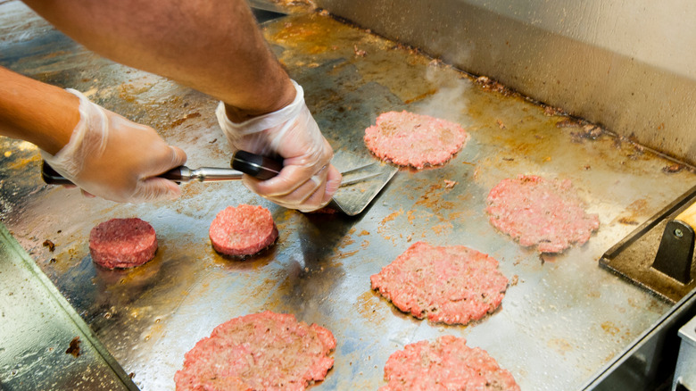 steak 'n shake steakburgers being grilled