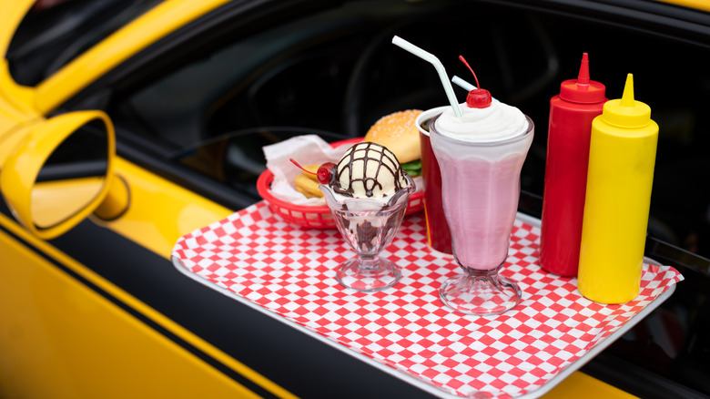 Yellow car with attached tray of food