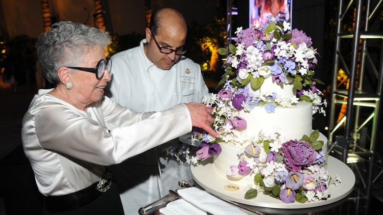 Sylvia Weinstock preparing a floral wedding cake