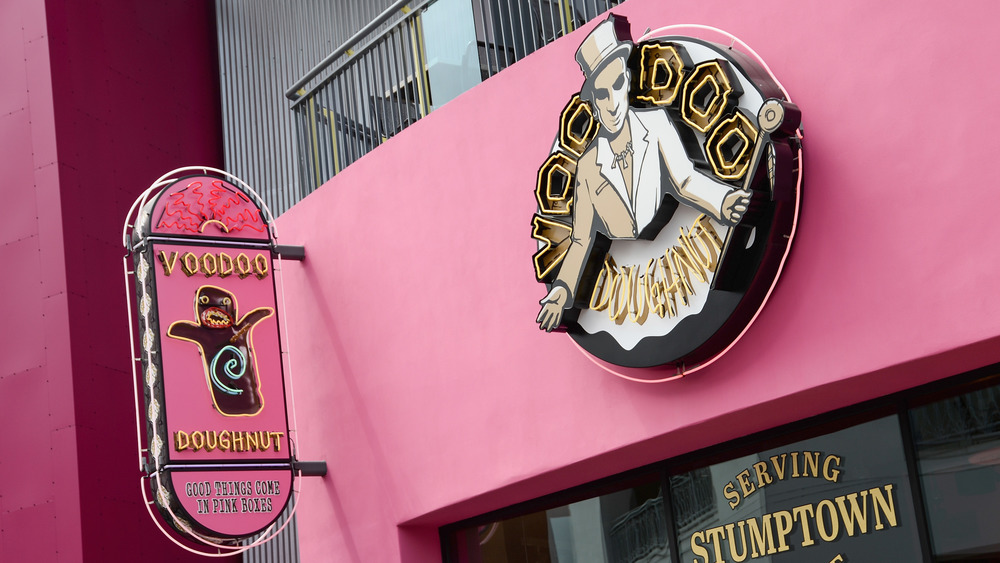 Voodoo Doughnut location signs