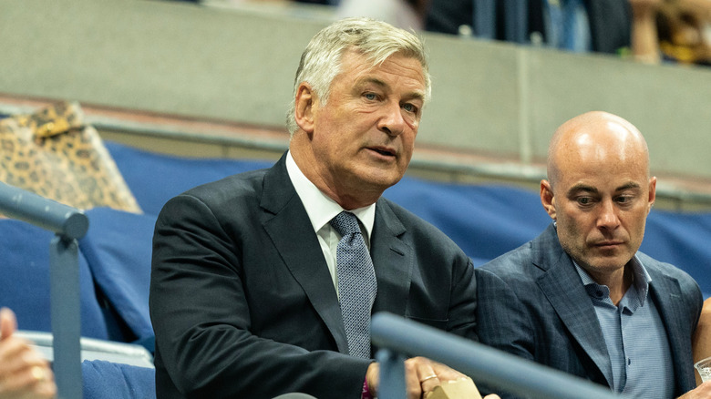 Alec Baldwin wearing dark suit