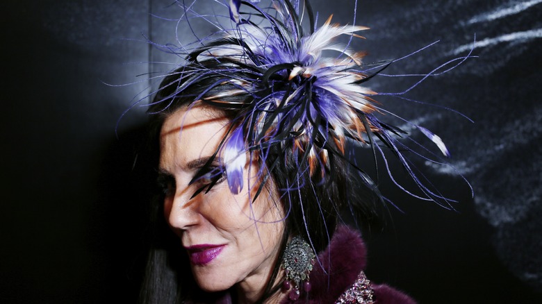 Barbara Lazaroff in feathered headpiece