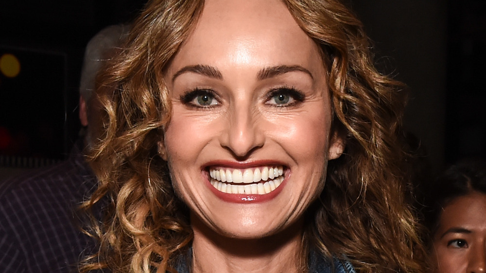 Giada De Laurentiis smiling with red lipstick