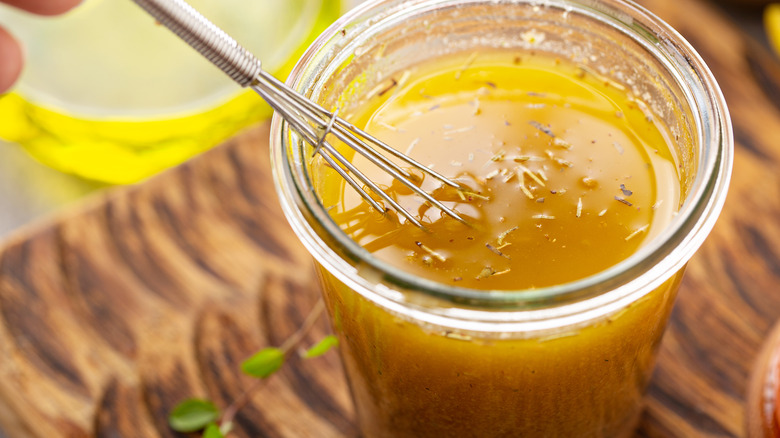 Cup of homemade Italian dressing