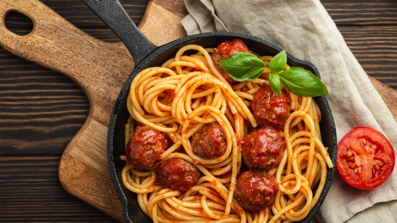 Spaghetti and meatballs in a skillet