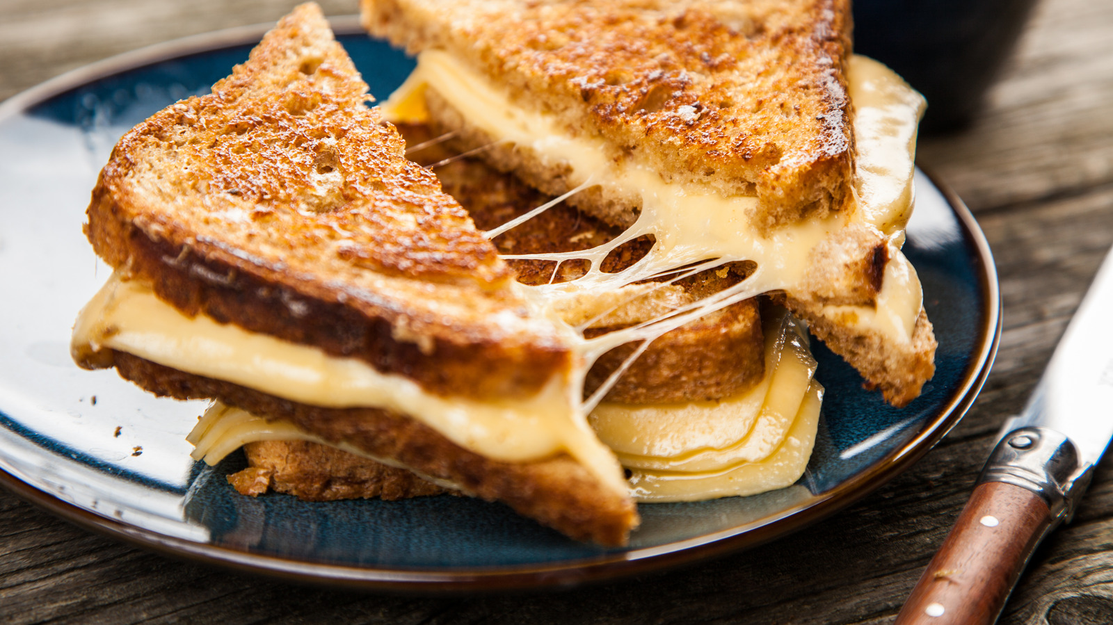 The Unusual Ingredients Bobby Flay Always Adds To His Grilled Cheese