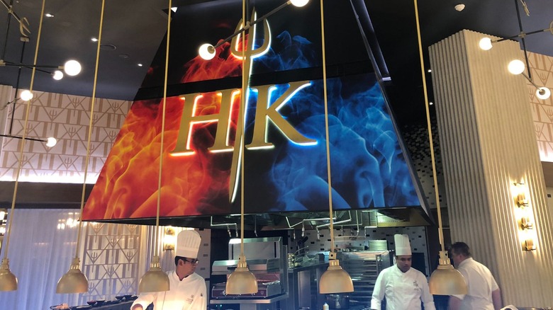 Chefs cooking at Hell's Kitchen Dubai