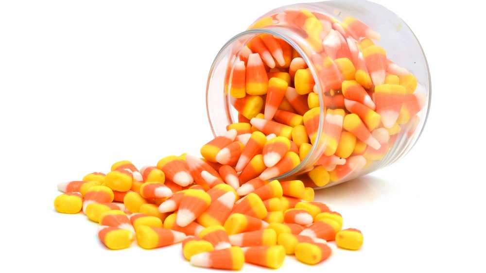 candy corn spilling out of jar
