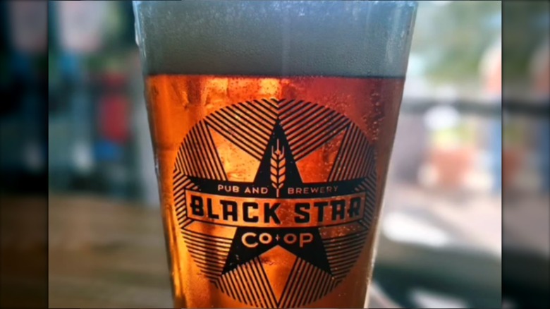 Black Star Co-Op logo on beer pint glass