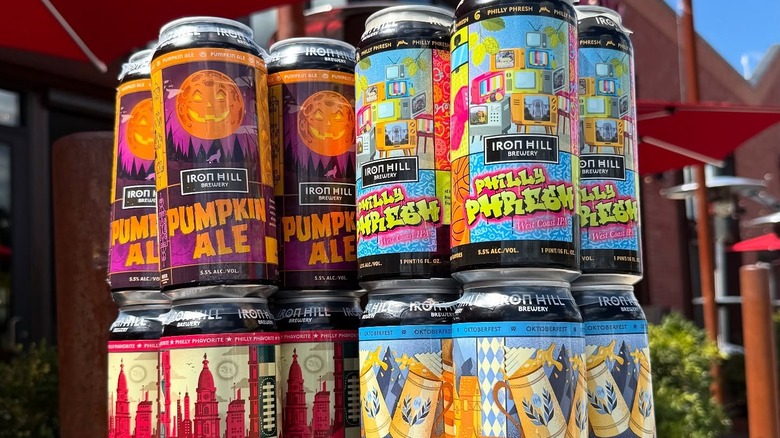 four stacked four-packs of Iron Hill beers