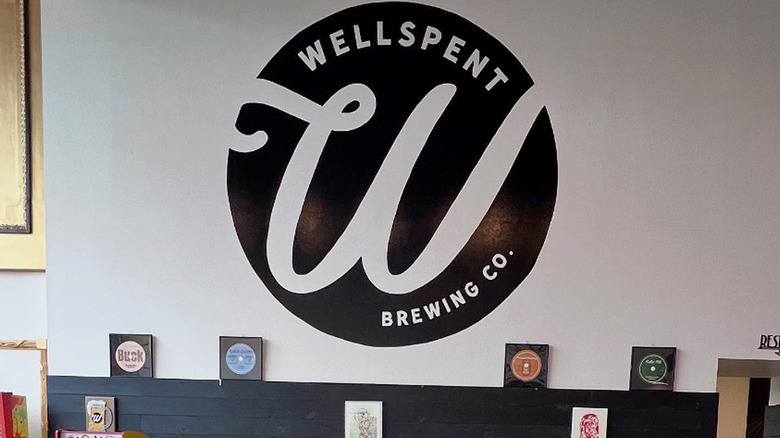 painted Wellspent Brewing logo inside taproom
