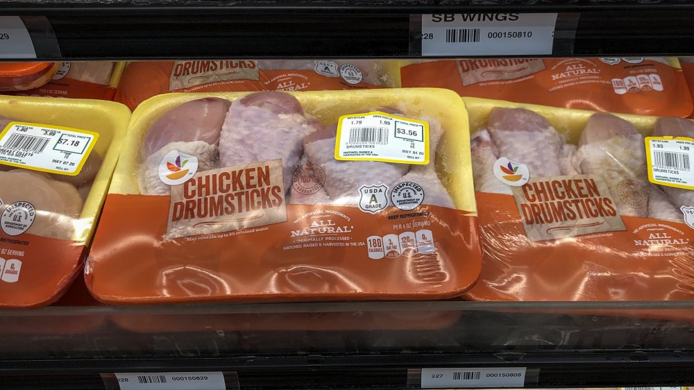 packaged chicken drumsticks in a supermarket