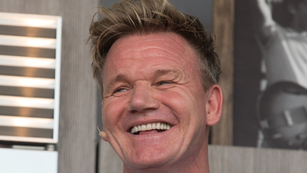 Gordon Ramsay laughing into microphone
