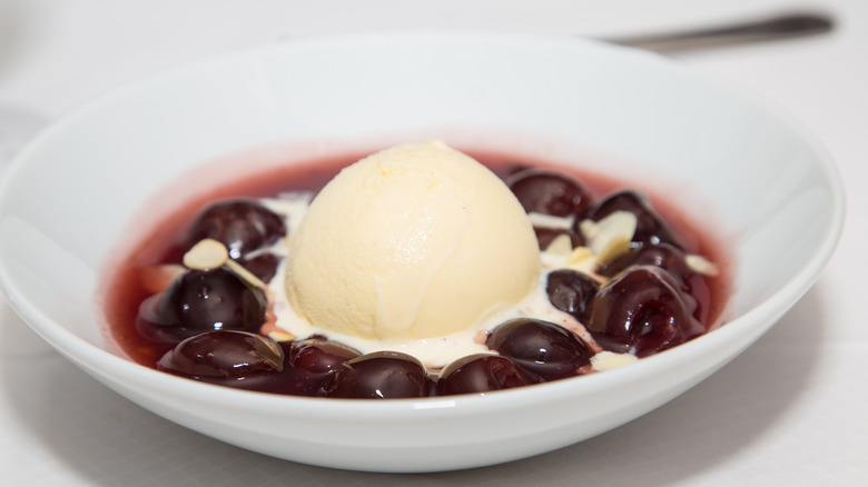 cherries jubilee with ice cream in bowl