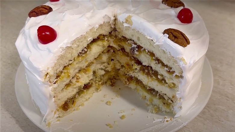 Homemade Lane cake with slices removed