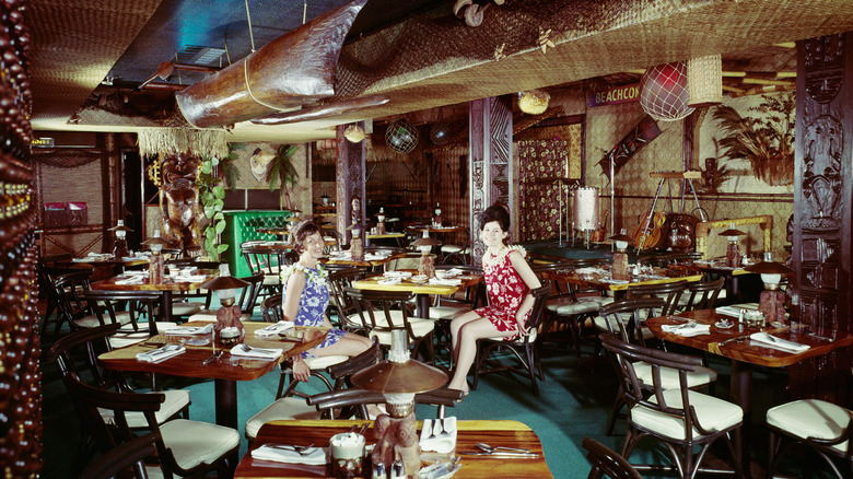 A vintage photo of women in a Polynesian-themed restaurant