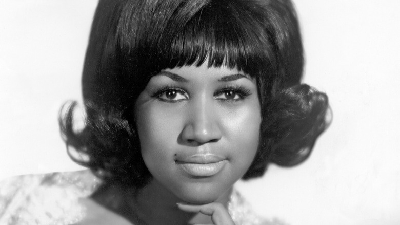 Aretha Franklin smirking