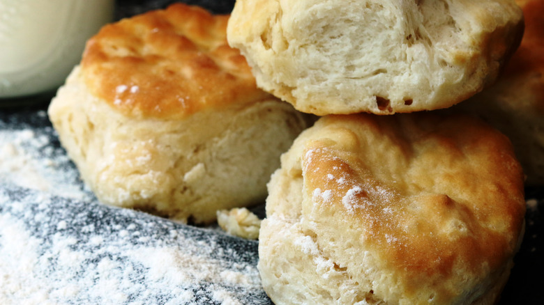Closeup of buttermilk biscuits on floured cloth