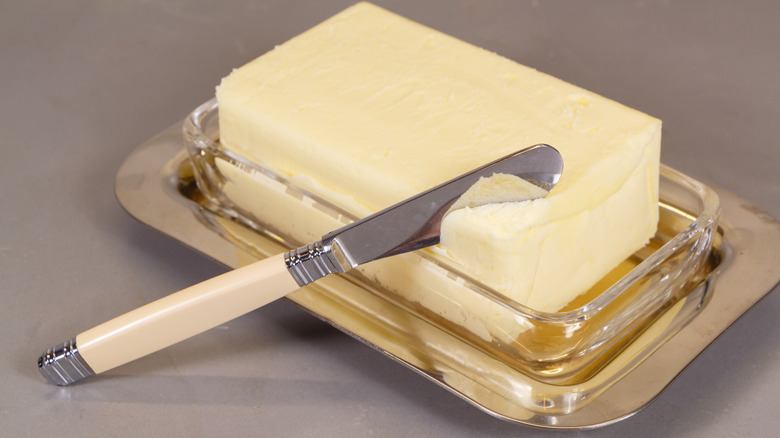 butter on tray with antique style knife