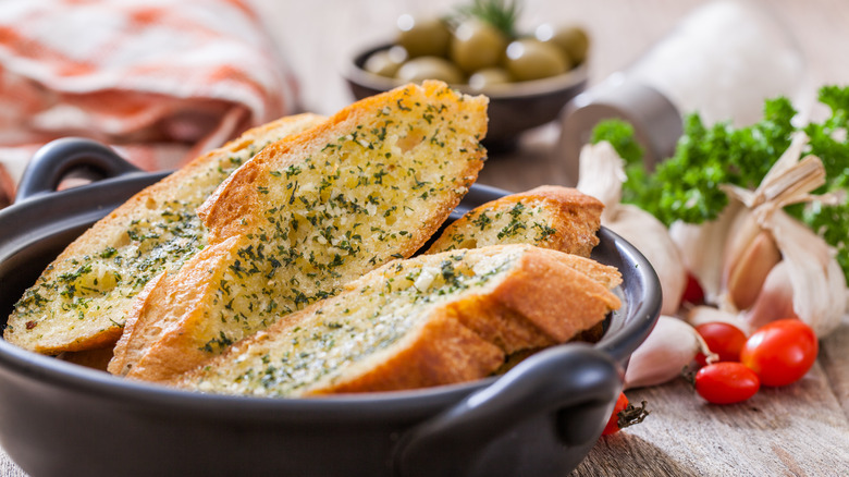 garlic bread next to fresh ingredients