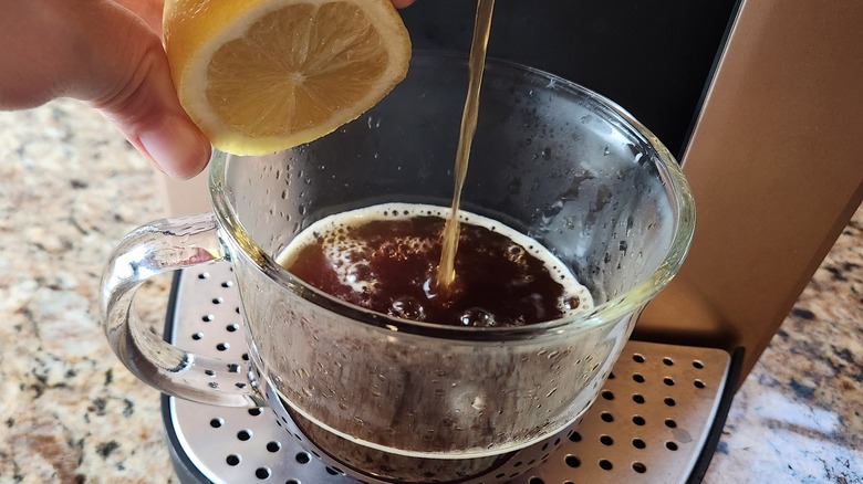 squeezing lemon into Keurig coffee