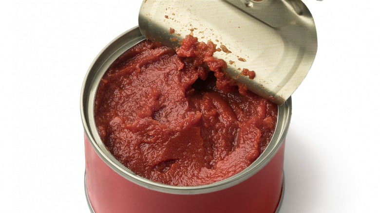 Opened can of tomato paste