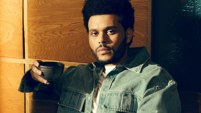 The Weeknd holding cup of Samra Origins coffee