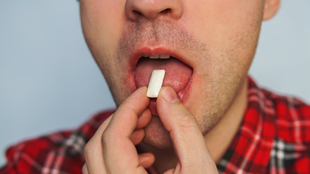 A man chews gum