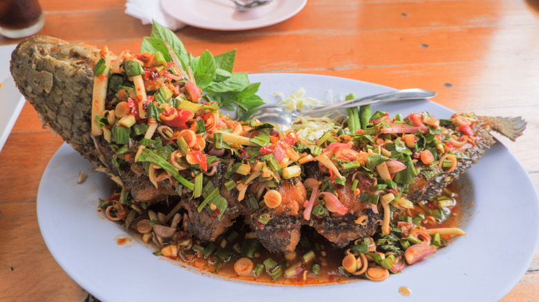 Plate of whole fried snakehead fish