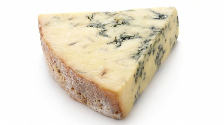 Slice of Stilton blue cheese