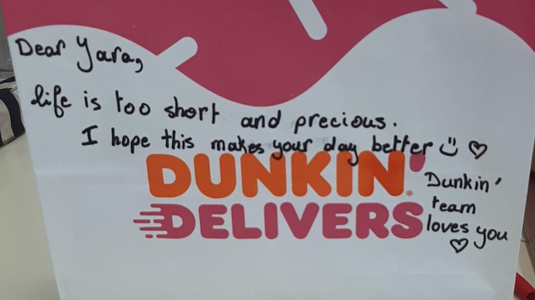 note on Dunkin' Donuts food bag