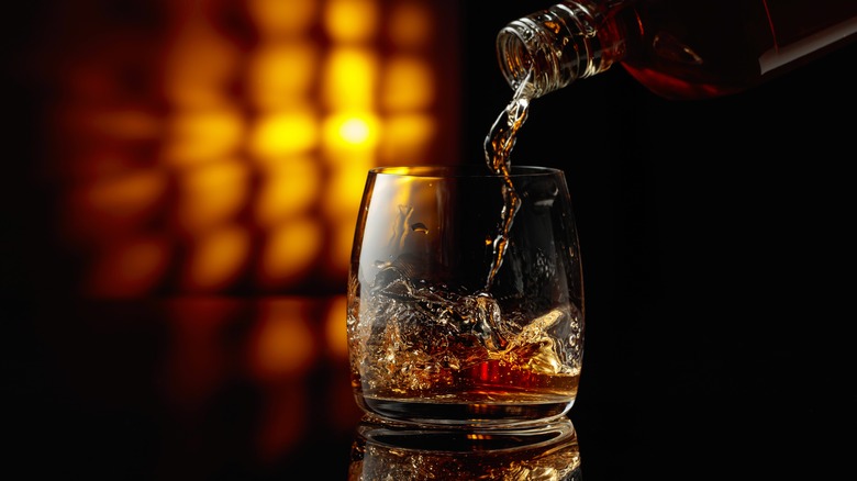 Bourbon being poured into a glass