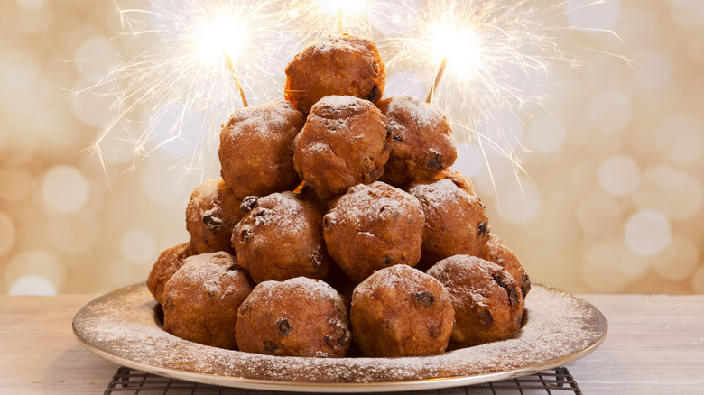 plate of oliebollen with sparklers
