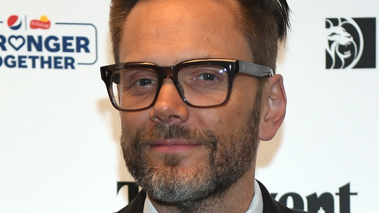 Joel McHale wearing glasses at event